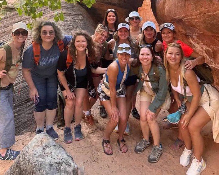 Group of friends hiking in rocky area.